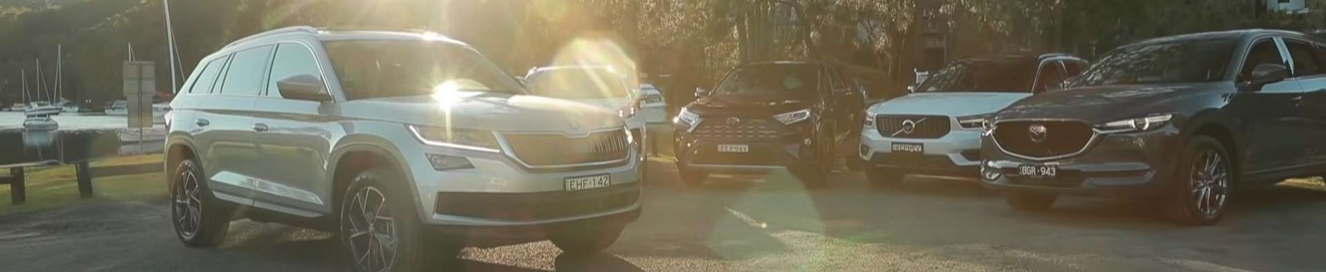 Row of cars parked in a showroom