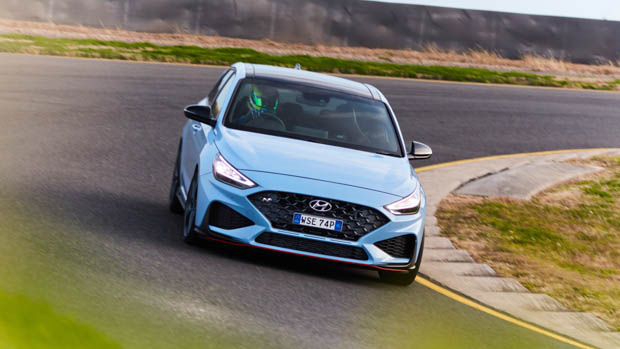 2021 Hyundai i30 N blue hatch cornering heading within the accurate direction