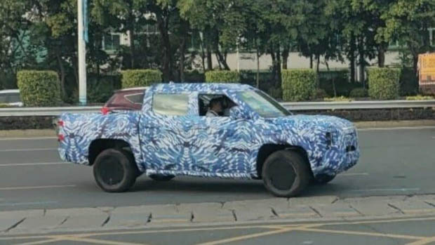 2023 BYD ute prototype aspect perspective on road