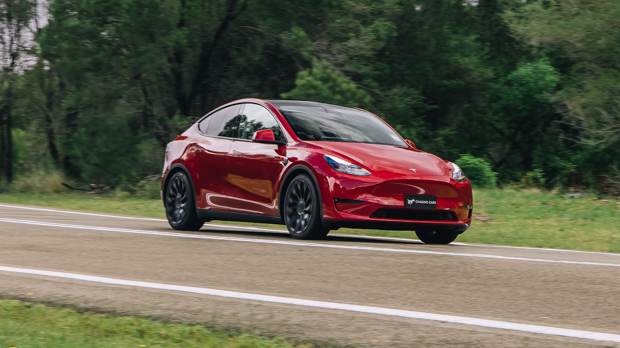 2023 Tesla Mannequin Y Efficiency red aspect cornering