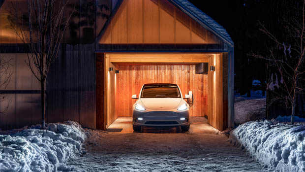 2023 Tesla Mannequin Y parked in garage snow