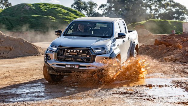 2023 Toyota Hilux GR Sport driving thru mud