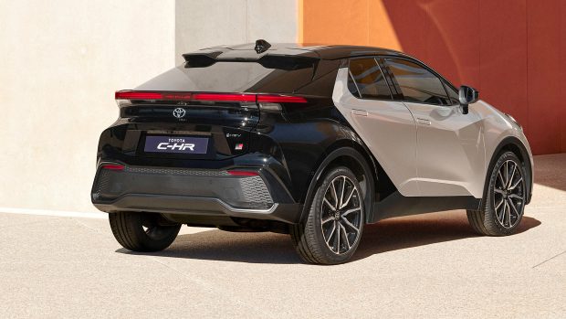 Silver and murky 2023 Toyota C-HR shrimp SUV, rear 3/4 exterior shot