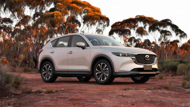 2024 Mazda CX-5 Touring white entrance 3/4