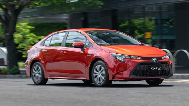 2020 Toyota Corolla Ascent Sport hybrid orange riding shot