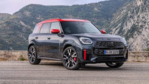 2024 Mini Countryman JCW front 3/4 static shot with mountain background