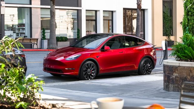 2024 Tesla Mannequin Y crimson charging